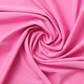 A swirled sample of EcoTechFlex recycled polyester spandex in the color Phlox Pink