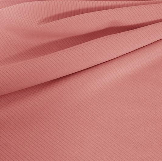 A draped sample of double ribbed spandex in the color blush.