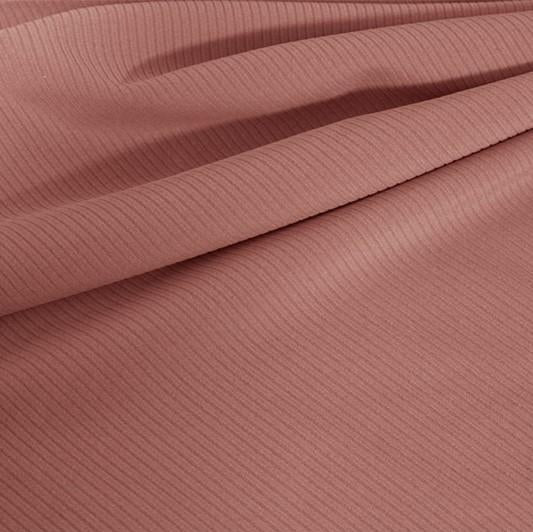 A draped sample of double ribbed spandex in the color champagne.