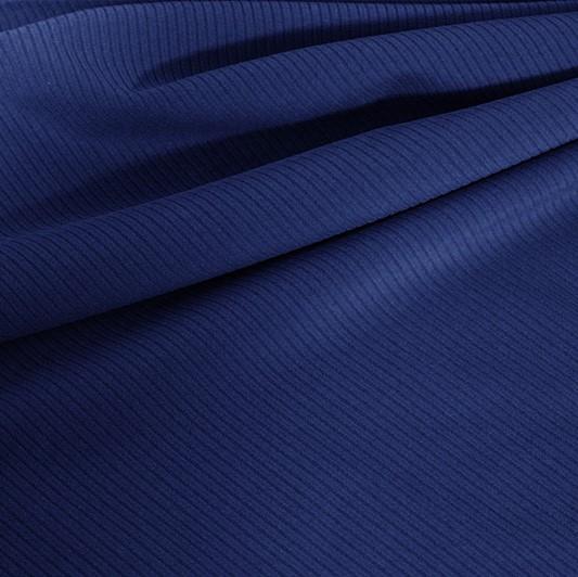 A draped sample of double ribbed spandex in the color denim.