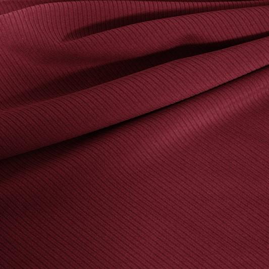 A draped sample of double ribbed spandex in the color burgundy.