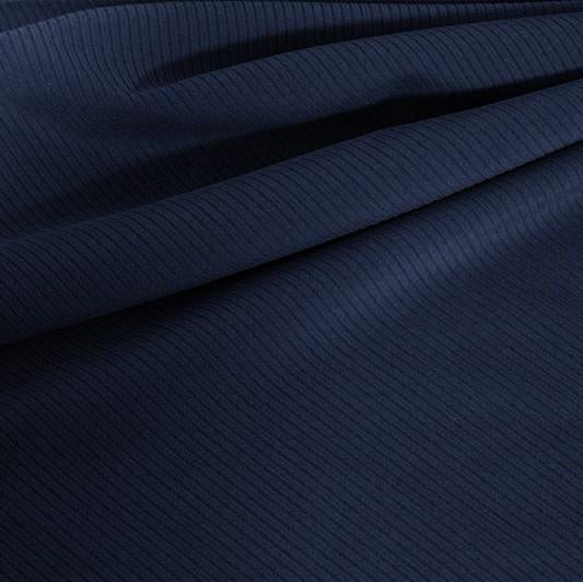 A draped sample of double ribbed spandex in the color marine navy.