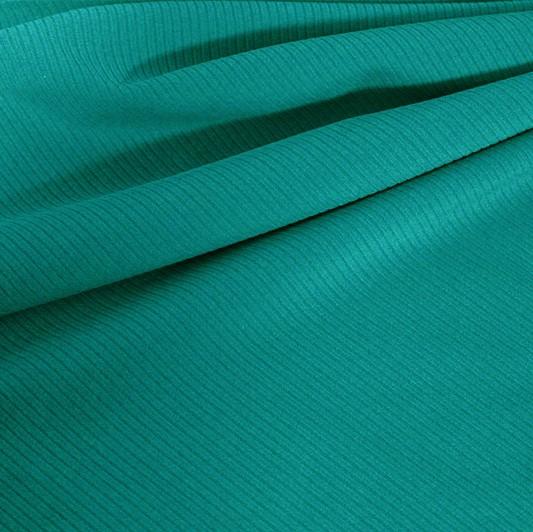 A draped sample of double ribbed spandex in the color ocean.