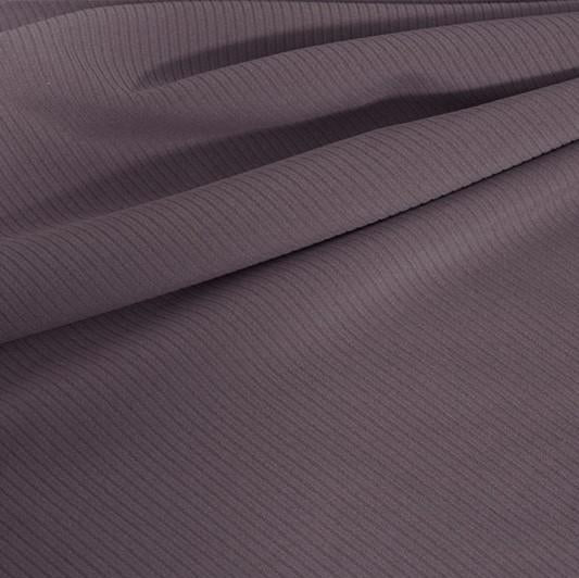 A draped sample of double ribbed spandex in the color toasted mauve.