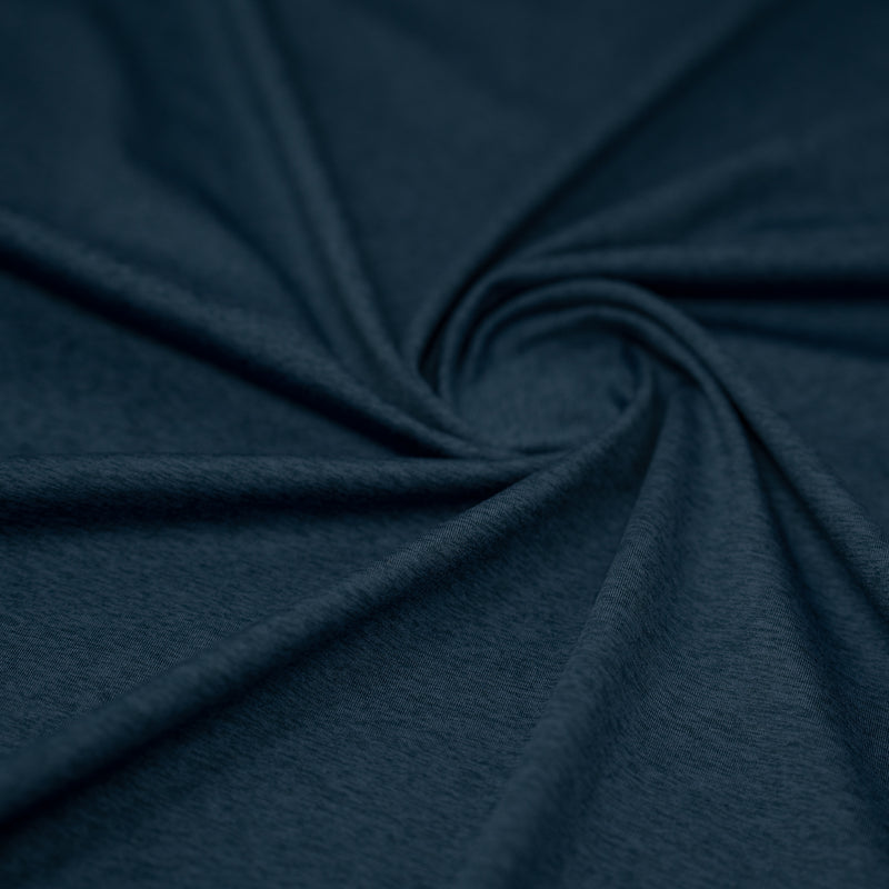 A swirled sample of EcoDelish Double Peached Melange recycled polyester spandex fabric in the color Poseidon Blue.