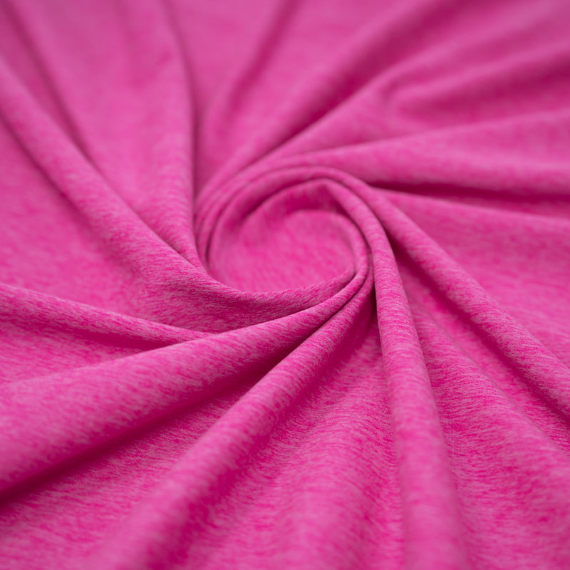 A swirled sample of EcoDelish Double Peached Melange recycled polyester spandex fabric in the color Positive Pink.