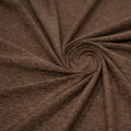 A swirled sample of EcoDelish Double Peached Melange recycled polyester spandex fabric in the color Toasted.