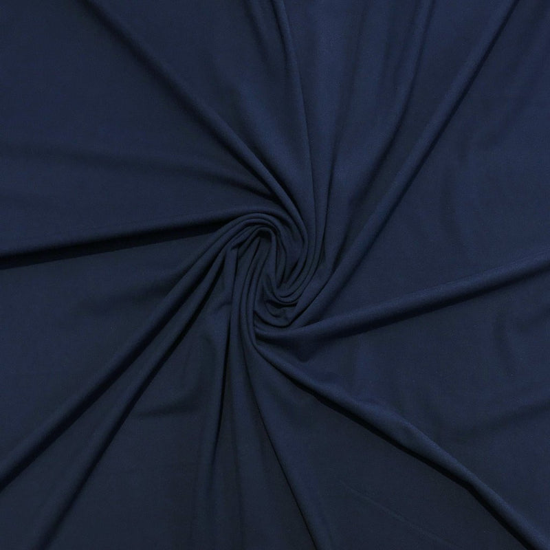 A swirled sample of exoflex recycled polyester spandex in the color denim