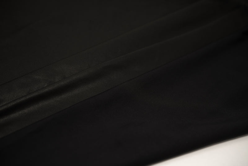 Detailed photograph of EcoTechFlex Distressed Foiled Recycled Polyester Spandex in color Black/Matte Black.