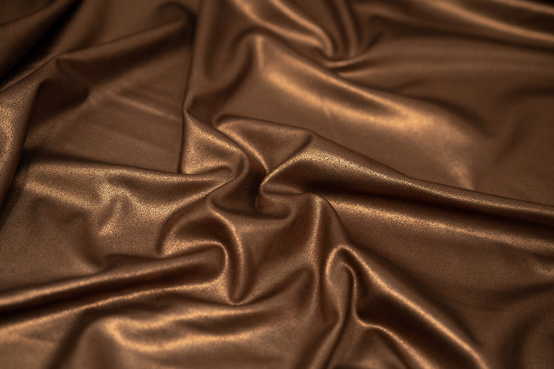 Detailed photograph of EcoTechFlex Distressed Foiled Recycled Polyester Spandex in color Coffee/Matte Dark Brown.