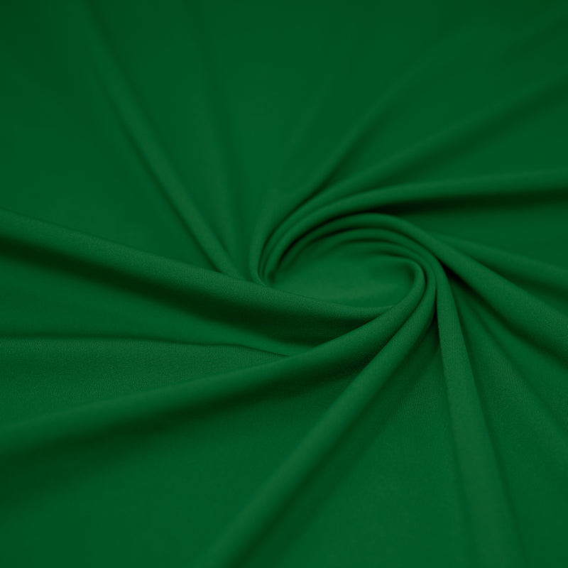 A swirled sample of EcoTechFlex recycled polyester spandex in the color Botanical Green.