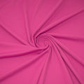 A swirled sample of EcoTechFlex recycled polyester spandex in the color Positive Pink