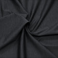 A swirled sample of ecodelish double peached heather recycled polyester spandex fabric in the color black.
