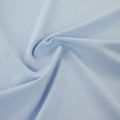 A swirled sample of ecotechflex recycled polyester spandex in the color powder blue.