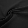 A swirled sample of ecotechflex recycled polyester spandex in the color black.