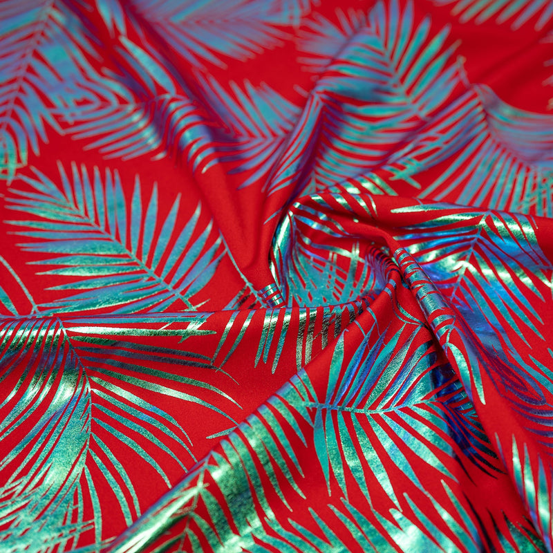 Detailed shot of Electric Palm Foil Printed Spandex in Red.