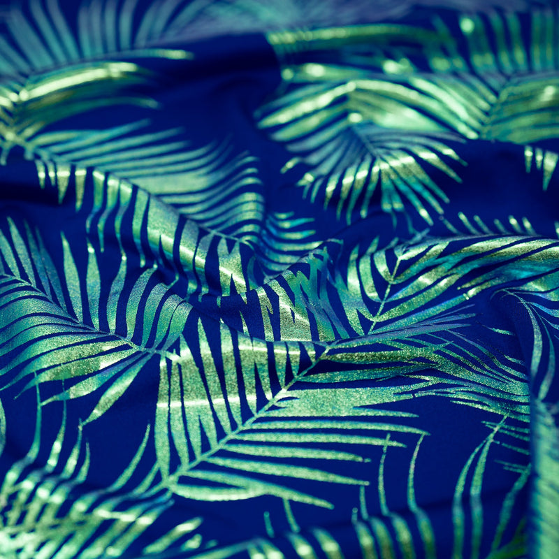 Detailed shot of Electric Palm Foil Printed Spandex in Royal.