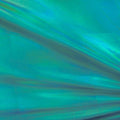 A flat sample of electric foiled spandex in the color turquoise.