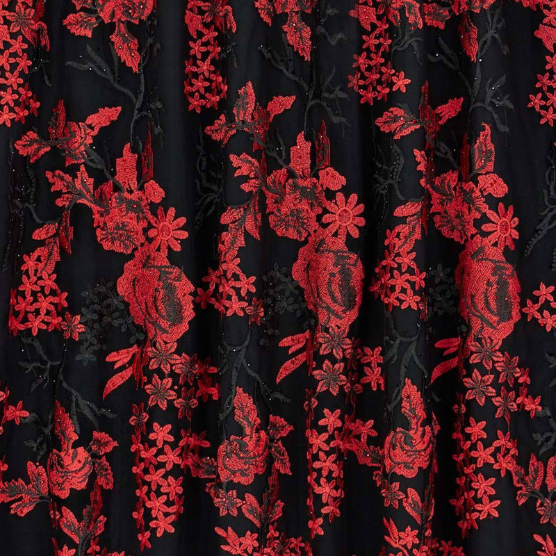 A flat sample of eve embroidered mesh in the color black-red.