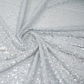 Swirled piece of exquisite stretch mesh sequin in the color White-Silver available at blue moon fabrics.