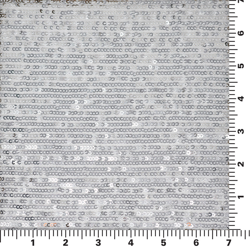 A flat sample of exquisite stretch mesh sequin in the color White-Silver available at blue moon fabrics.