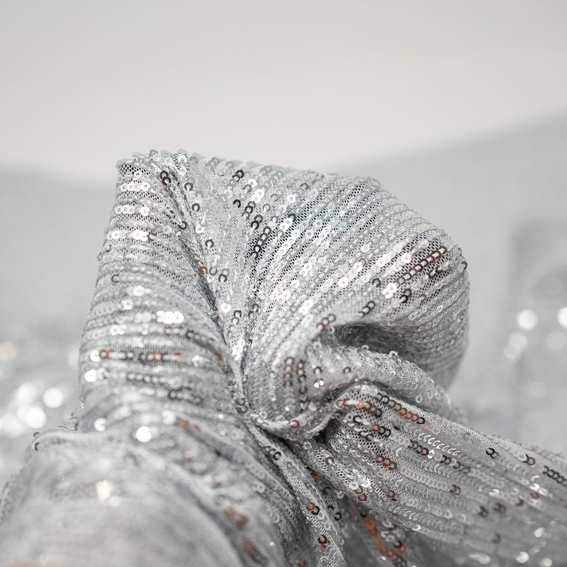Detailed shot of exquisite stretch mesh sequin in the color White-Silver available at blue moon fabrics.