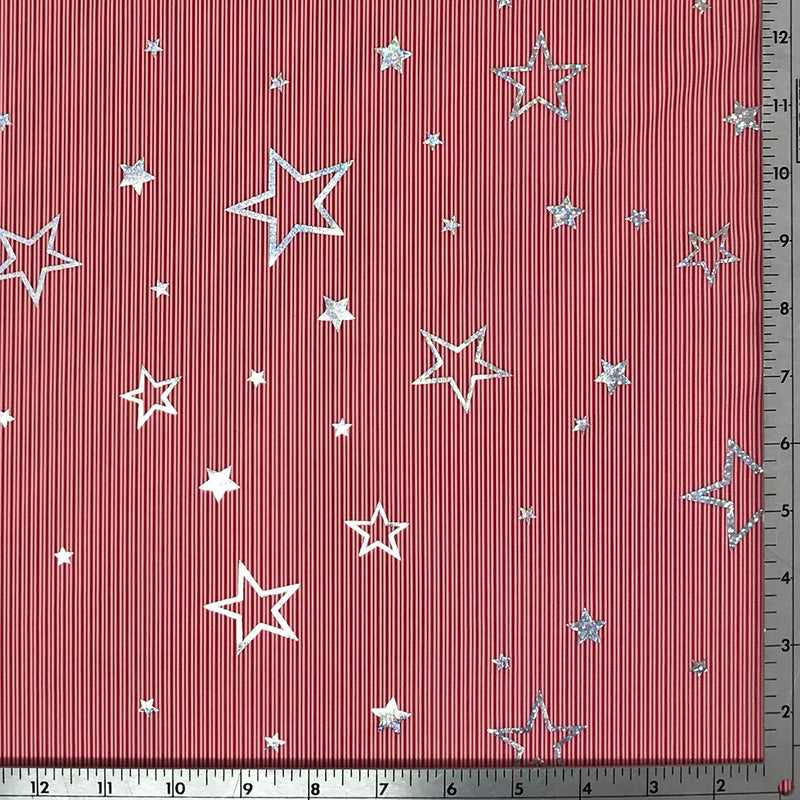 A flat sample of candy stripe stars foil printed spandex.
