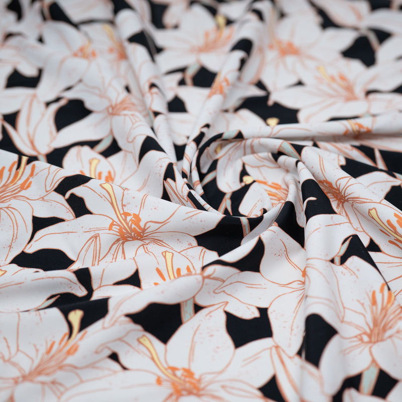 A swirled piece of White Lilies Printed Spandex.