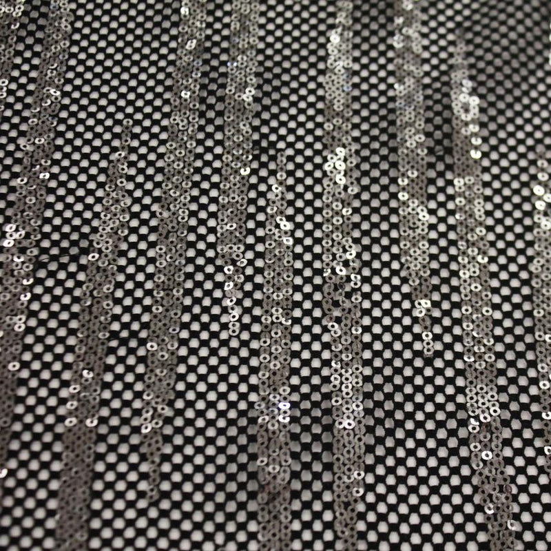 A flat sample of flair stretch mesh sequin in the color black-silver.