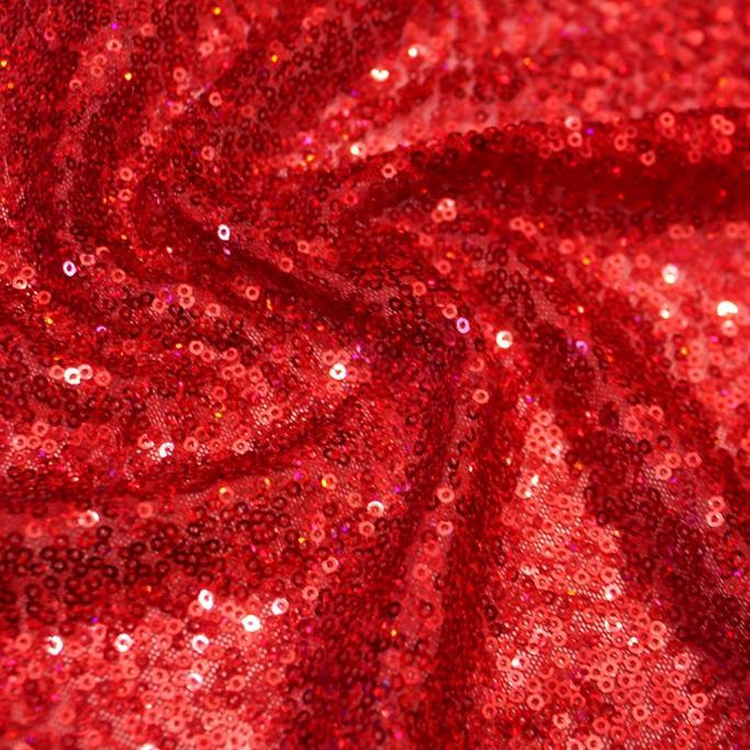 A swirled sample of flirt stretch mesh sequin in the color red.