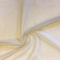 A swirled sample of foiled stretch mesh in the color nude-silver.