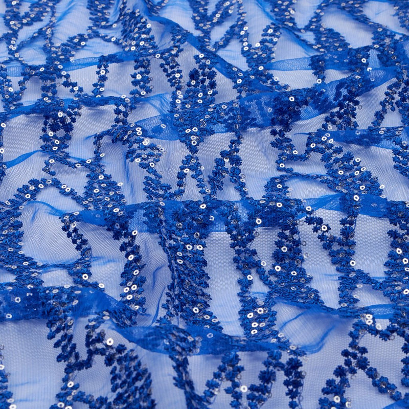 A flat sample of forget me not embroidered mesh in the color royal blue.