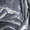 A crumpled pieces of Frozen Crushed Stretch Velvet in the color steel