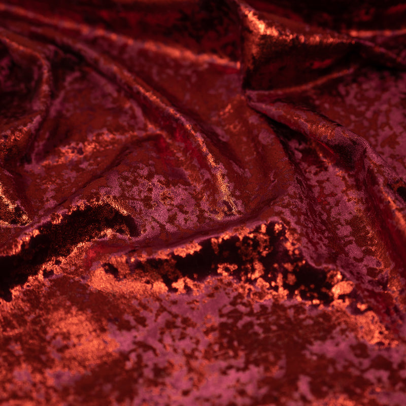 A crumpled piece of Gilded Stretch Velvet in Burgundy-Red