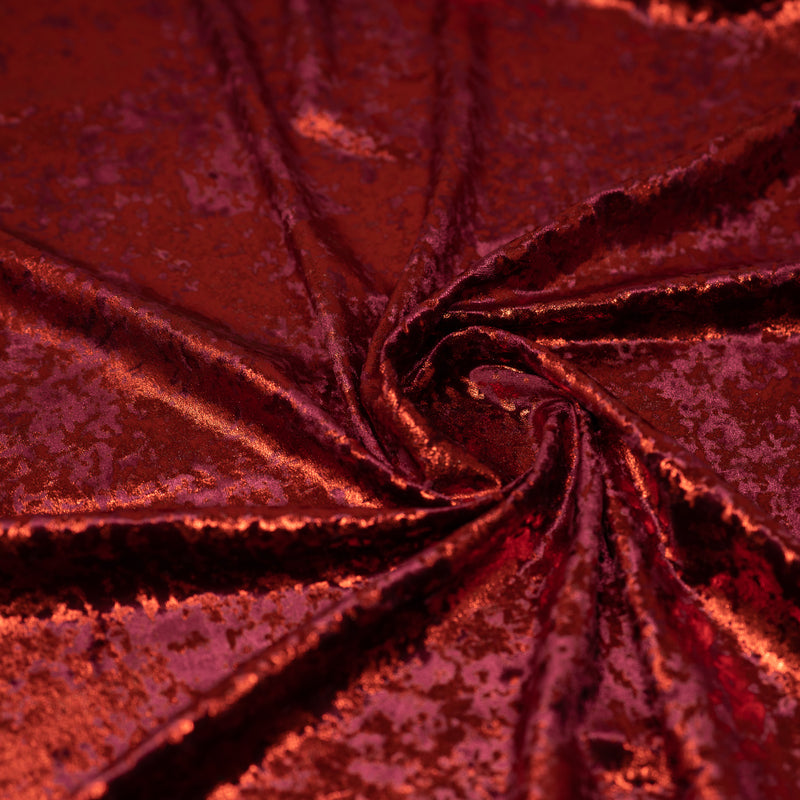 A swirled sample of Gilded Stretch Velvet in Burgundy-Red 