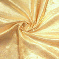 A swirled sample of goddess foiled strtch mesh in the color nude-gold.