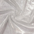 A swirled sample of goddess foiled strtch mesh in the color white-silver.
