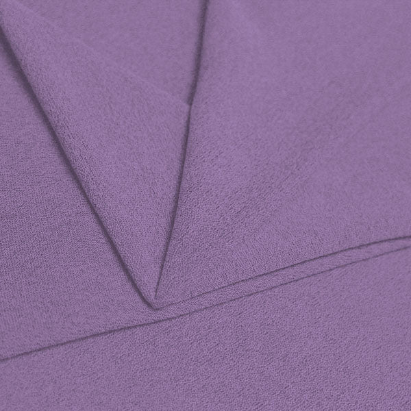 A folded piece of Blast Textured Spandex in bright lilac.