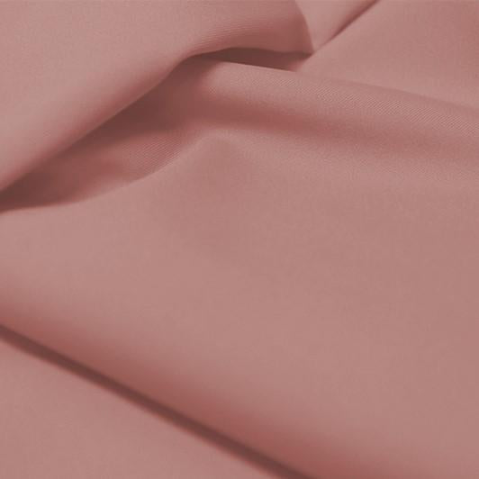 A flat sample of allure polyester spandex in the color champagne.