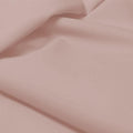 A flat sample of allure polyester spandex in the color cheeky.