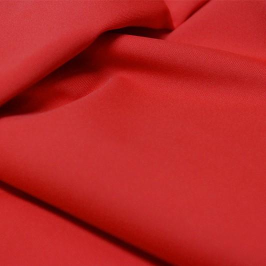A flat sample of allure polyester spandex in the color classic car red.