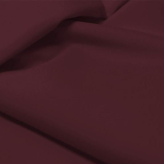 A flat sample of allure polyester spandex in the color fig.