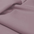 A flat sample of allure polyester spandex in the color grape mist.