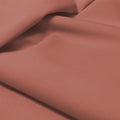 A flat sample of allure polyester spandex in the color mystic mauve.
