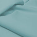 A flat sample of allure polyester spandex in the color sunday blue.