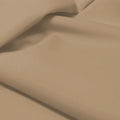 A flat sample of allure polyester spandex in the color taupe.