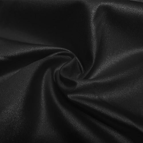 A swirled piece of nylon spandex fabric with an all over shiny look in the color black.