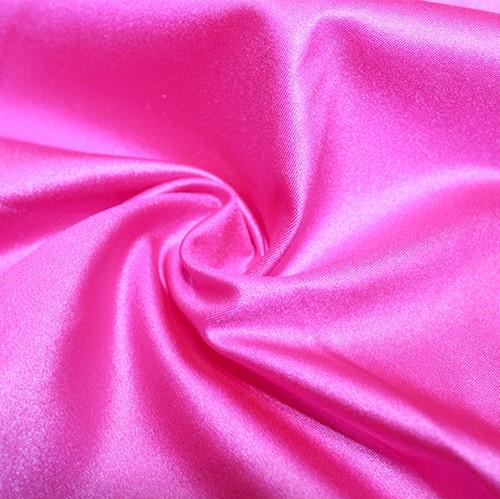 A swirled piece of nylon spandex fabric with an all over shiny look in the color famous.