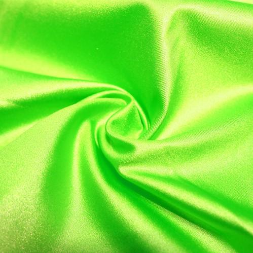 A swirled piece of nylon spandex fabric with an all over shiny look in the color neon lime.