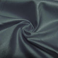 A swirled piece of nylon spandex fabric with an all over shiny look in the color symphony.